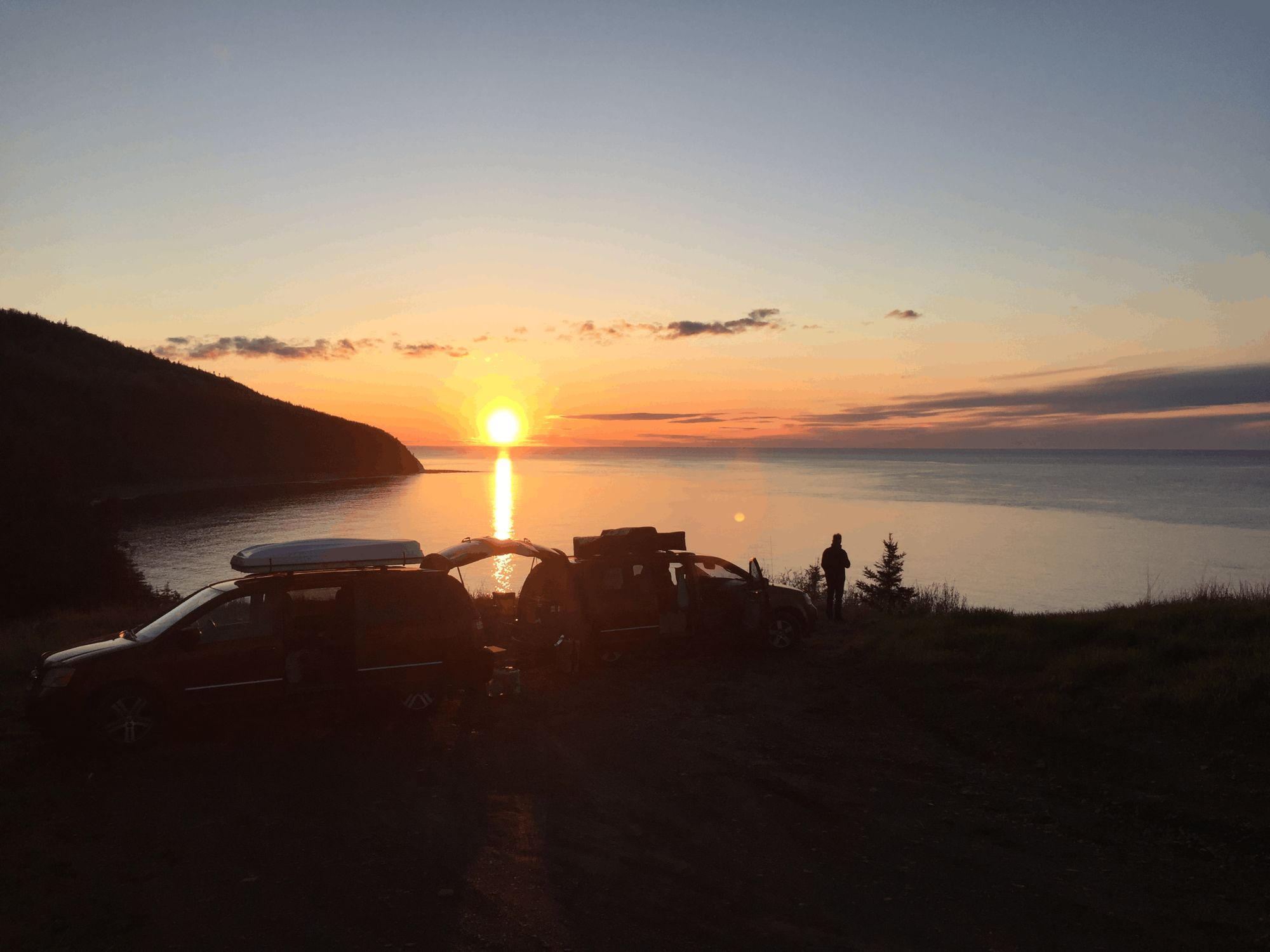 converted minivans at sunset