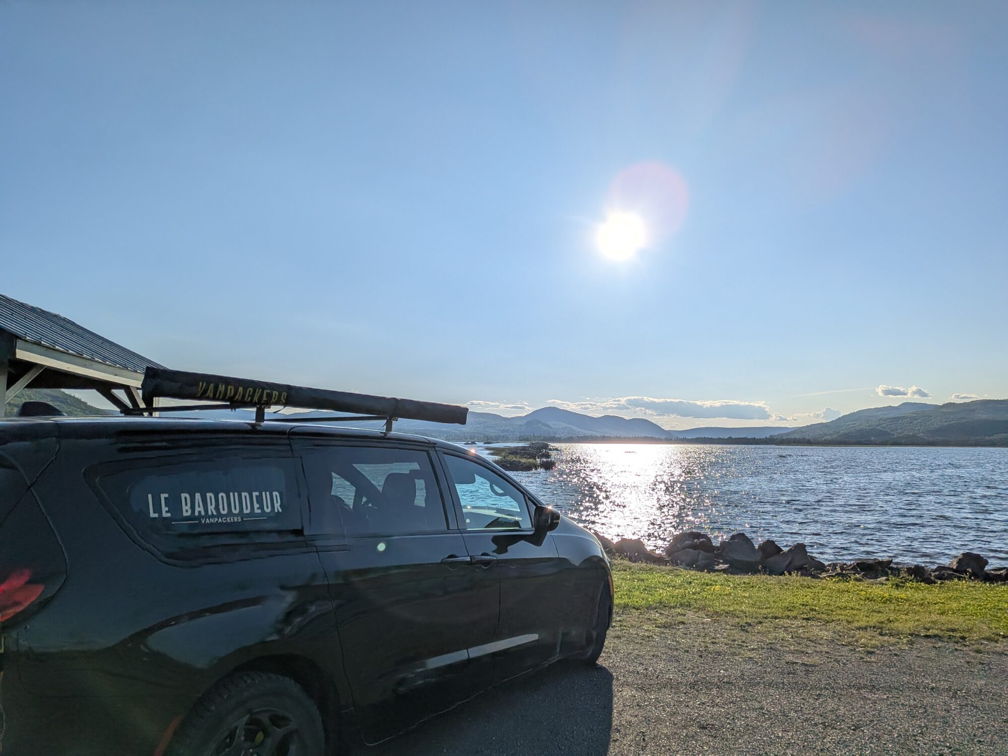 converted minivan by the water